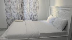 Кровать или кровати в номере Sky Blue Apartment