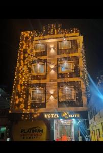 a hotel building with lights on it at night at Hotel Shree Elite in Ratlām