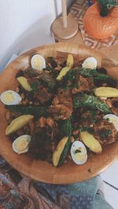 a plate of hard boiled eggs and vegetables on a table at Dar ettawfik free parking inside in Tataouine +59 photos