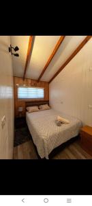 a bedroom with a bed in a room at Apartamento Puerta A La Patagonia 2 in Chaitén