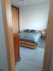 Postel nebo postele na pokoji v ubytování Przytulny Kąt