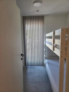 Una cama o camas en una habitación de Samen Aan Zee