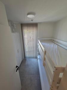 Una cama o camas en una habitación de Samen Aan Zee