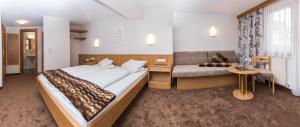 Postel nebo postele na pokoji v ubytování Hotel Idhof