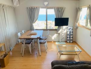 Μια τηλεόραση ή/και κέντρο ψυχαγωγίας στο Guest House Marine View - Vacation STAY 62152v
