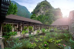 a rendering of a building with flowers and plants at The Banjaran Hotsprings Retreat in Ipoh