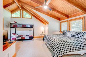 a bedroom with a bed and a tv in a room at The Tree House at Echota in Boone +52 photos