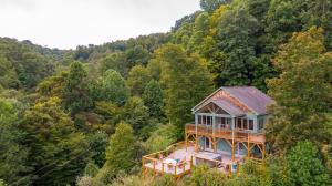 an overhead view of a house in the woods at River View Retreat in Boone