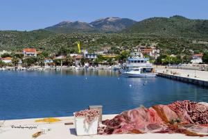 a view of a harbor with a boat in the water at lady diana in Skala Kallirachis
