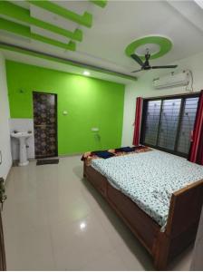 Postel nebo postele na pokoji v ubytování Divyesh Holiday Home + 1 fotografie