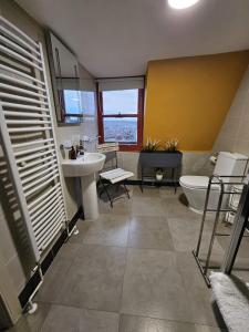 a bathroom with a sink and a toilet at Hill House in Bath
