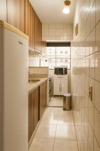 Køkken eller tekøkken på Terraza 450 BC - Varanda - Garagem - 450m praia - Wi-Fi 500 Mbps