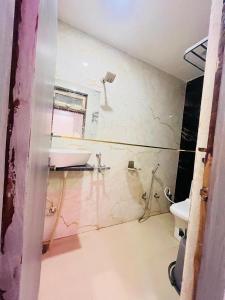 a bathroom with a sink and a tub and a toilet at Hotel Kaushalya in Ayodhya +29 photos