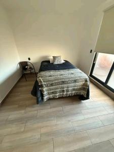 Postel nebo postele na pokoji v ubytování Adara Querétaro