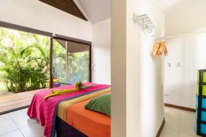 Un pat sau paturi într-o cameră la Villa Wolaba