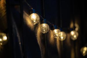 a bunch of lights hanging on a wall at Novita apartment 2 - central - balcony - mountain views in Bad Harzburg