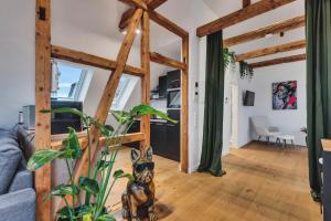 a living room with wooden beams at Novita apartment 2 - central - balcony - mountain views in Bad Harzburg