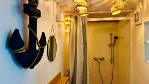 a bathroom with a shower and a mirror at L'Escale de Pontcarré - Disneyland Paris in Pontcarré +26 photos