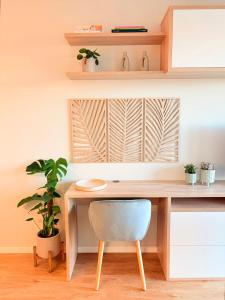 a desk with a chair in a room at New Douro Tower 206 with shared pool in Vila Nova de Gaia