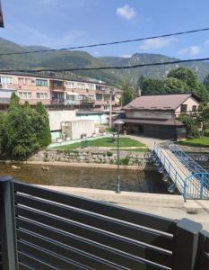 a bridge over a river with buildings in the background at Daily rental apartment Travnik in Travnik