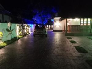 a car parked in a parking lot at night at KODIVEED Heritage in Alleppey