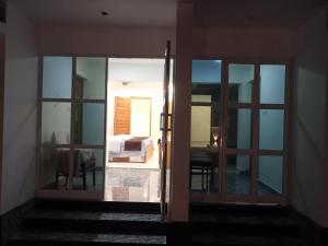a room with a door leading to a bedroom at KODIVEED Heritage in Alleppey