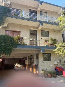 a building with a car parked in front of it at Hotel Saurabh in Saur