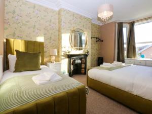 En eller flere senge i et værelse på Curzon Heights