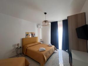 Ένα ή περισσότερα κρεβάτια σε δωμάτιο στο Casa Procida