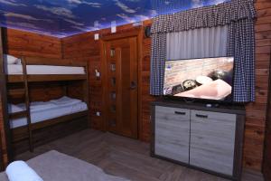 a room with two bunk beds and a sink at Cuki Residence in Mala Ravna Reka