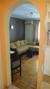 a living room with a couch and a table at Daria Apartment in Novi Sad