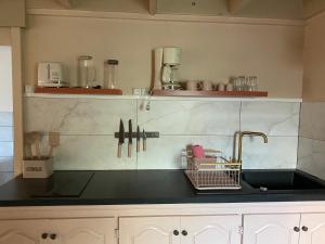 Η κουζίνα ή μικρή κουζίνα στο Appartement dans le quartier de terre sainte elona