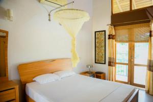 Una cama o camas en una habitación de Family Heart 34 fotos más