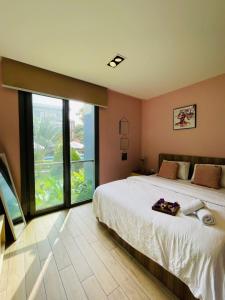 Ένα ή περισσότερα κρεβάτια σε δωμάτιο στο The Pearl In City by WOW Property - Direct from developer