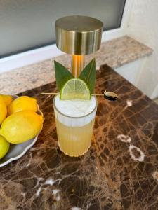 a drink sitting on a counter next to a juicer at Hotel Afrodita in Truskavets
