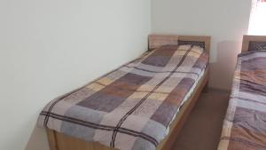 Postel nebo postele na pokoji v ubytování Asror`s homestay in Sentyab village