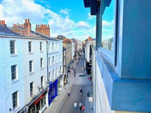 a view from a window of a street with buildings at York City Centre 2 Bed Flat with Views - Steps from Christmas Market in York