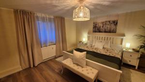 a bedroom with a large bed and a window at Apartement Victoria in Swisttal