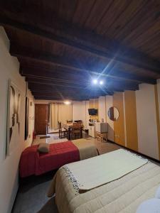 Ένα ή περισσότερα κρεβάτια σε δωμάτιο στο Tierra De Mestizos +16 φωτογραφίες