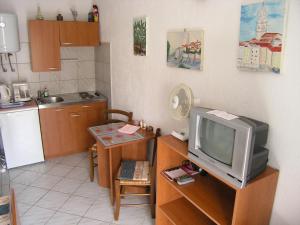 Kuchyň nebo kuchyňský kout v ubytování Apartmani Plach