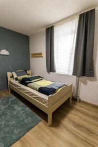 Ένα ή περισσότερα κρεβάτια σε δωμάτιο στο Apartmani ZOV GOLIJE