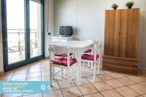 a white table and chairs in a room at Appartamento a Senigallia sul mare - SE004 in Senigallia