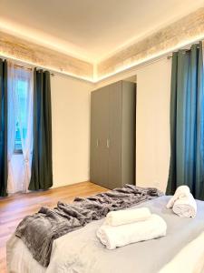 En eller flere senge i et værelse på Cortela Dimora Scaligera