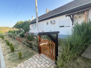 a house with a wooden gate in front of it at Dvorska oaza in Sremski Karlovci