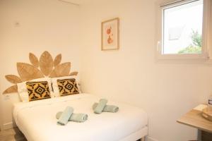 Ένα ή περισσότερα κρεβάτια σε δωμάτιο στο Résidence Zénith