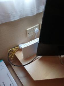 a computer monitor with a keyboard and mouse on a desk at The Franklin in Saint Osyth