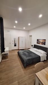 a large bedroom with a large bed in a room at Siciliano Palace - Deluxe Apartments & Spa in Bagheria