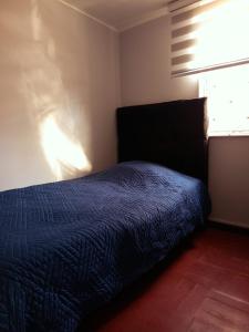 Ένα ή περισσότερα κρεβάτια σε δωμάτιο στο Hotel Rancagua, piezas simples dobles y familiares