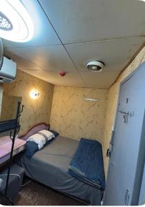 Postel nebo postele na pokoji v ubytování 金葉別墅