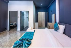 En eller flere senge i et værelse på NO 7 Garden Villa